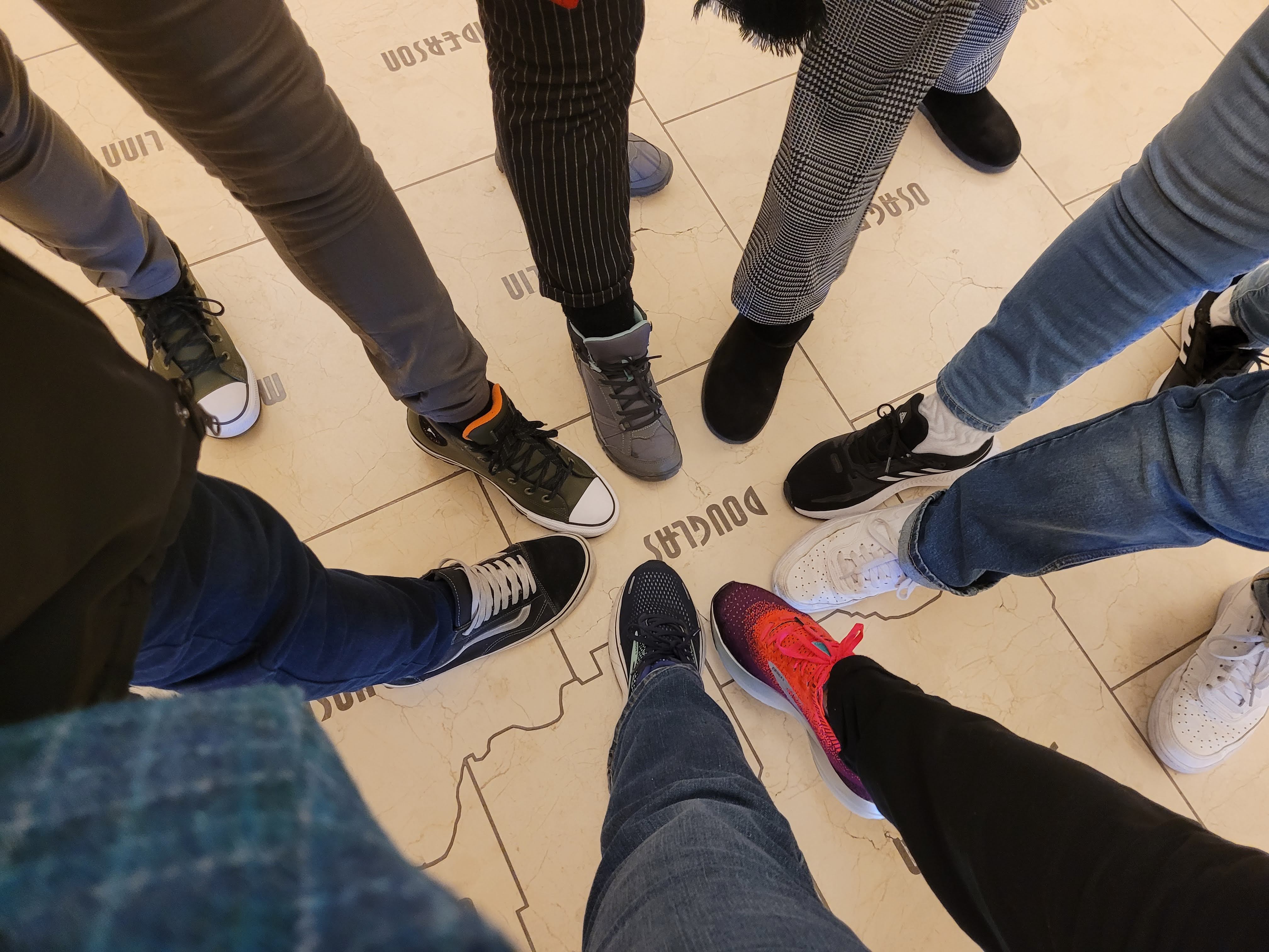 ISP participants standing on Douglas County on a floor map of Kansas