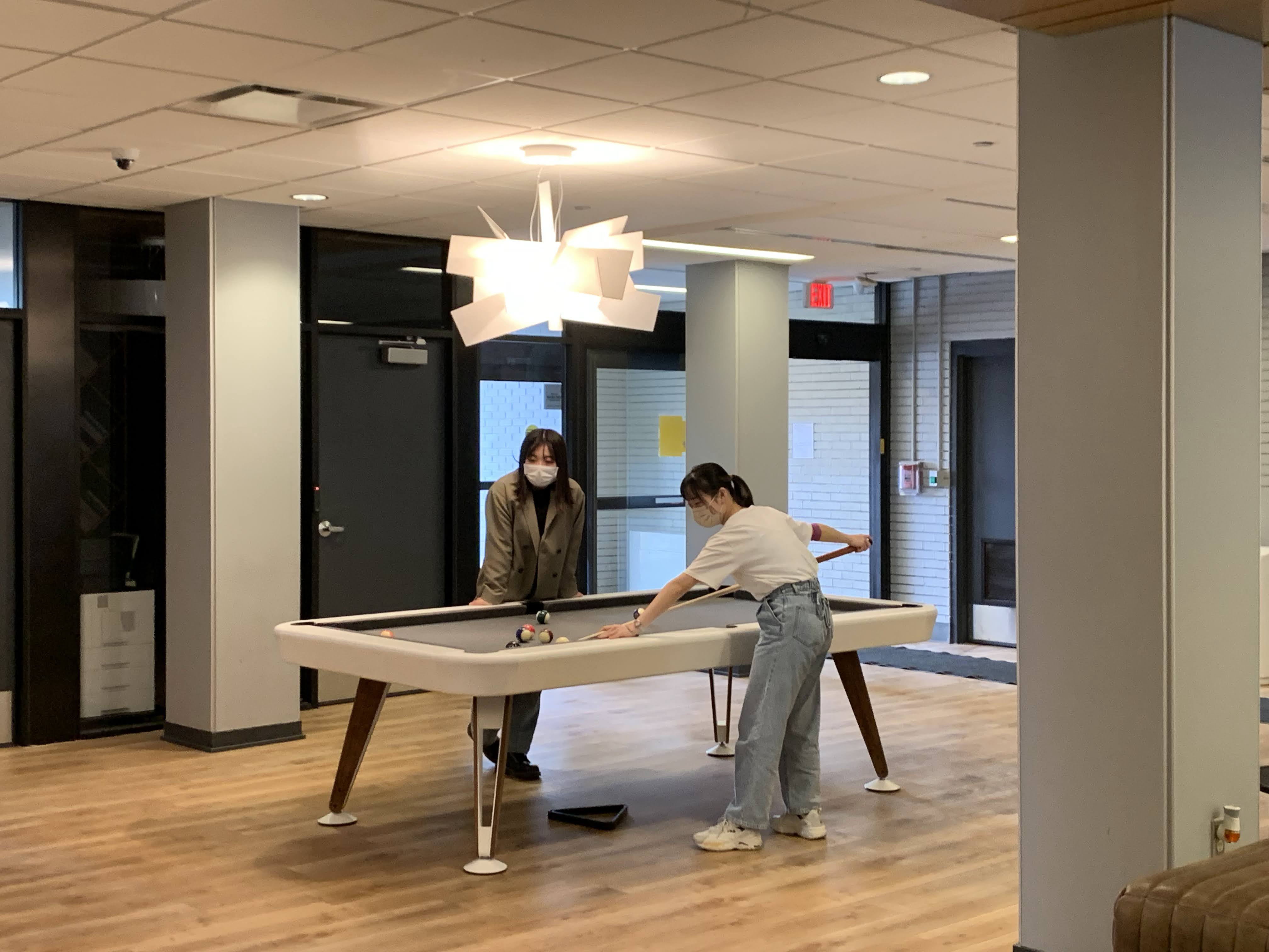 Kansai participants playing pool at Naismith Hall