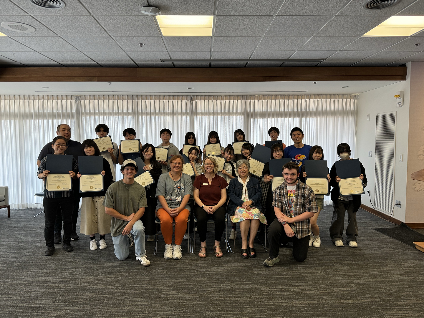 Japanese high school students with their completion certificates